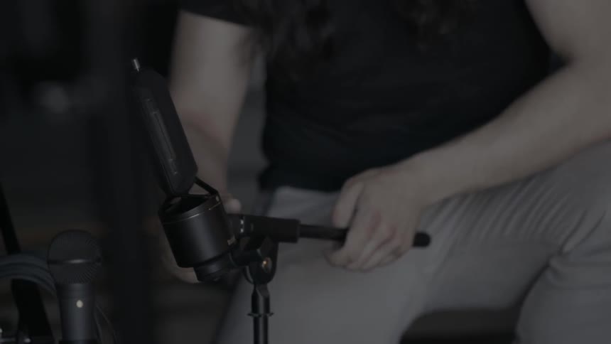 A woman adjusts a piece of equipment