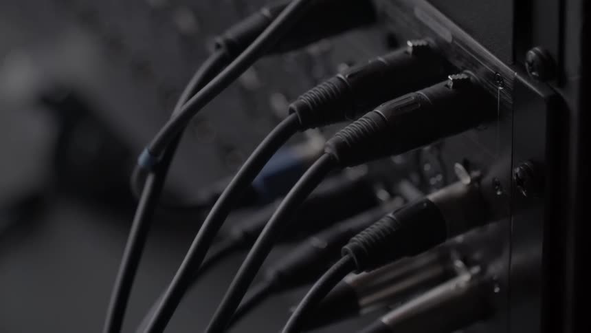 Analog cables are plugged into a console