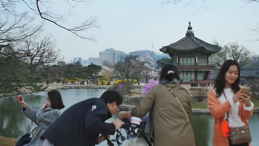 People take photos in a city area
