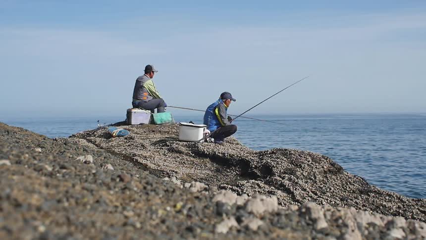 Men fishing from the shoreline