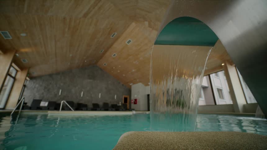 A swimming pool inside of a building