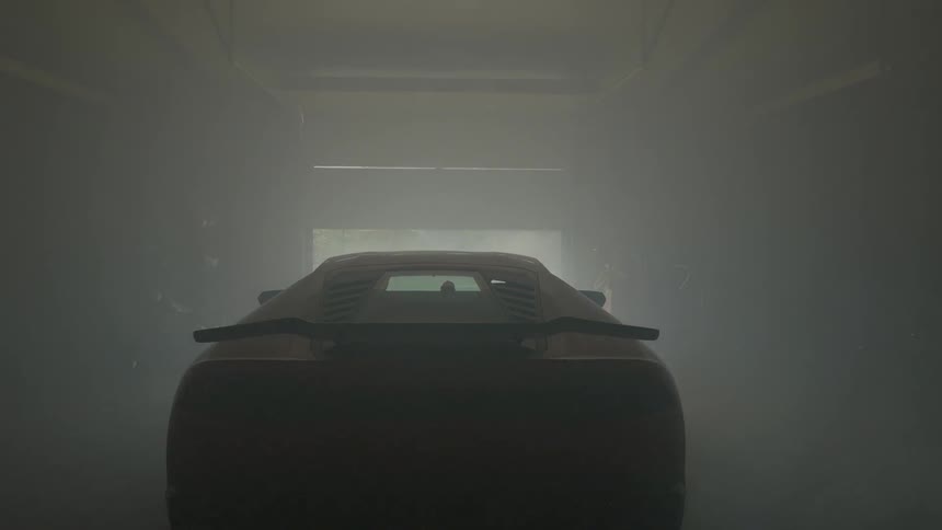 A car leaves a foggy garage