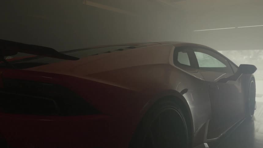 Sports car driving out of a garage