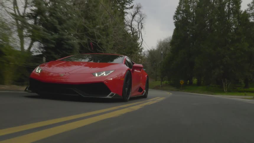 Sports car driving down a highway