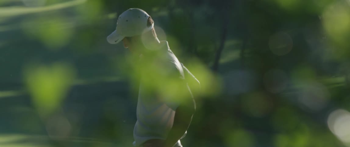 A golfer stands by the tee contemplating his next move
