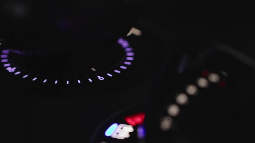 The dials on the panel are lit up in the dark