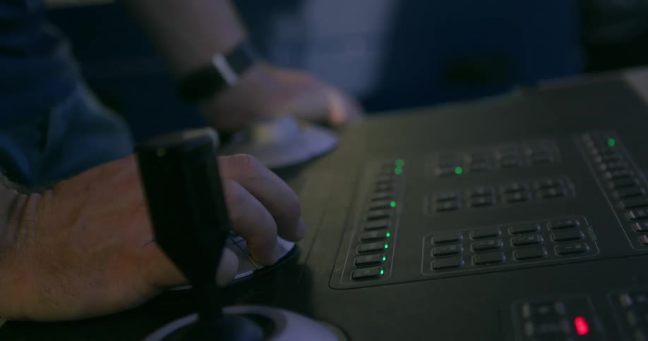 A man works on a piece of electronic equipment