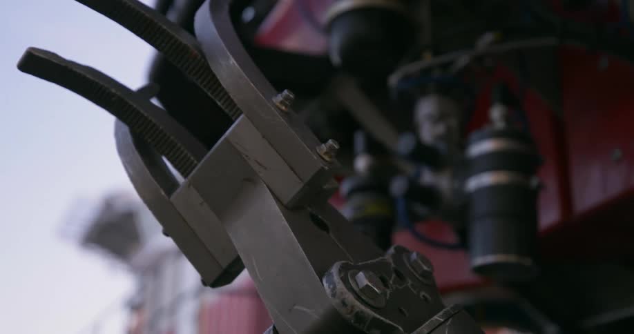 A manipulator arm on a heavy machine outdoors
