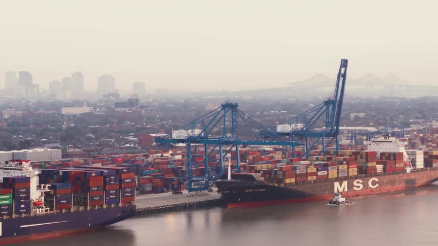 Shipping containers on boats on the water