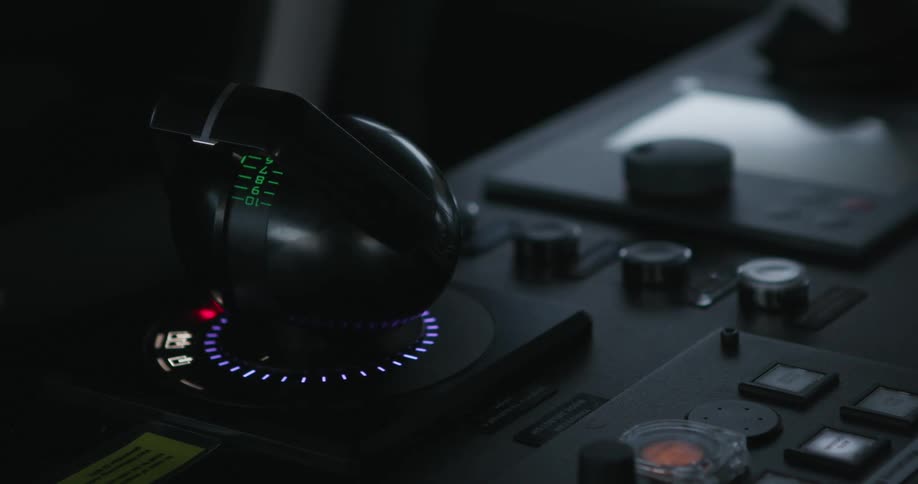 Control stick with blinking led lights and numbered markings occupies place on control board