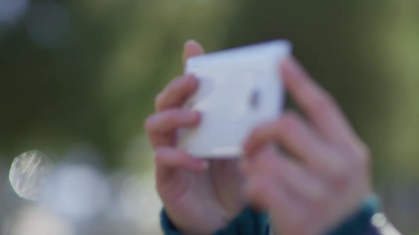 Woman takes a selfie with her smartphone
