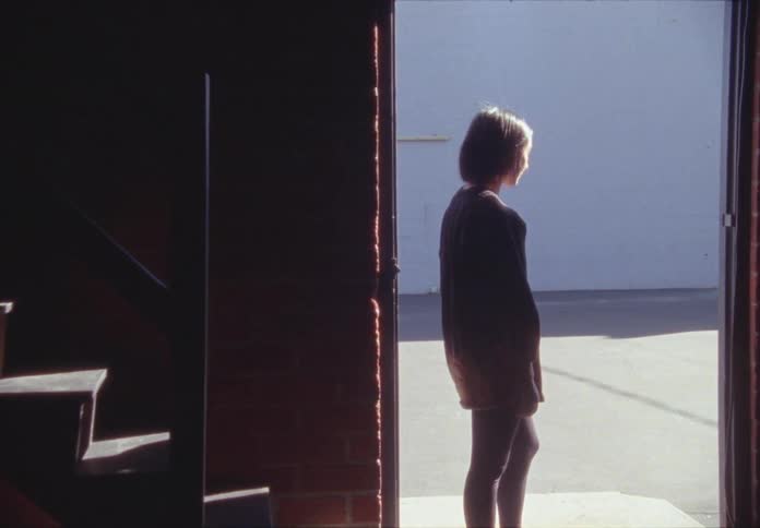 Woman stands in the doorway