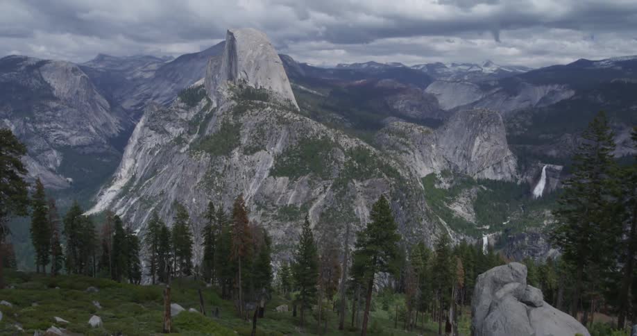 View of mountains and trees on a cloudy day