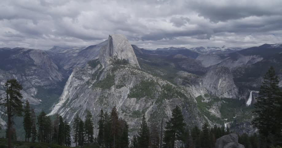 View of snow-capped mountain peaks on a cloudy day