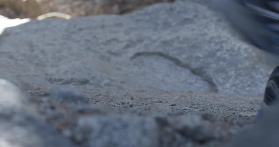 Close up of hikers' feet walking in a rocky area
