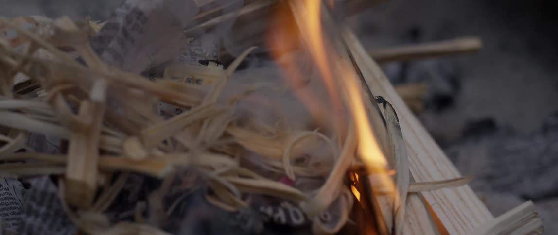 Fire burns through grass and wood