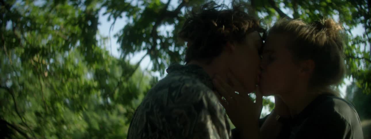 A man and woman arguing then the man kisses the woman