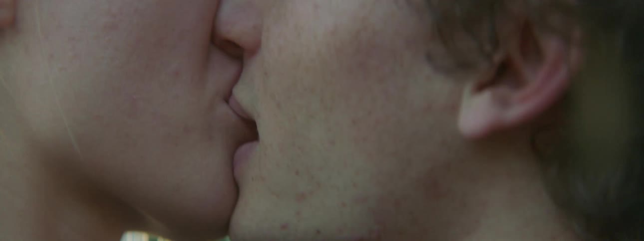 Man and woman kiss and touch each other passionately