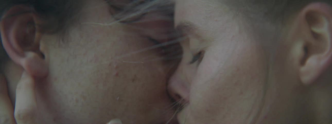 Man and woman kiss and touch each other