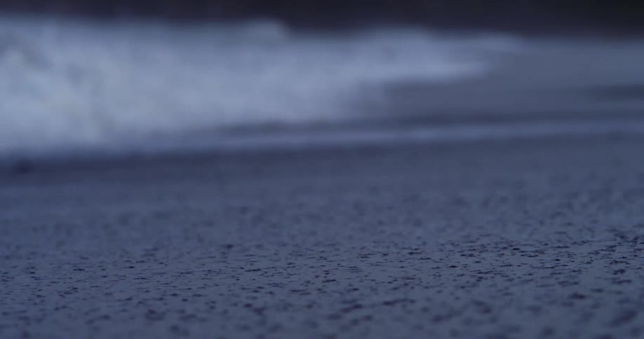 Waves crashing on the sands of a beach