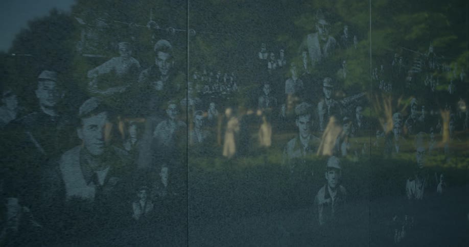 A reflection of trees on a mural of people
