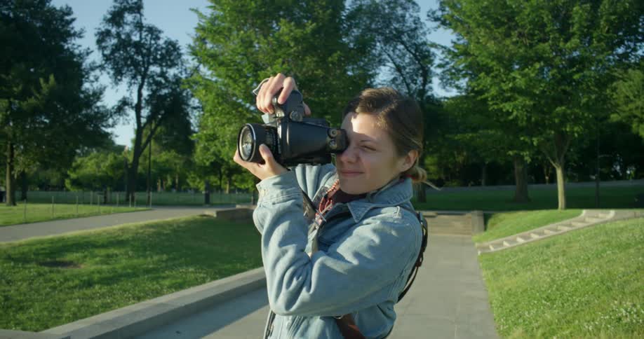 Photographer takes photos in a park with medium format camera