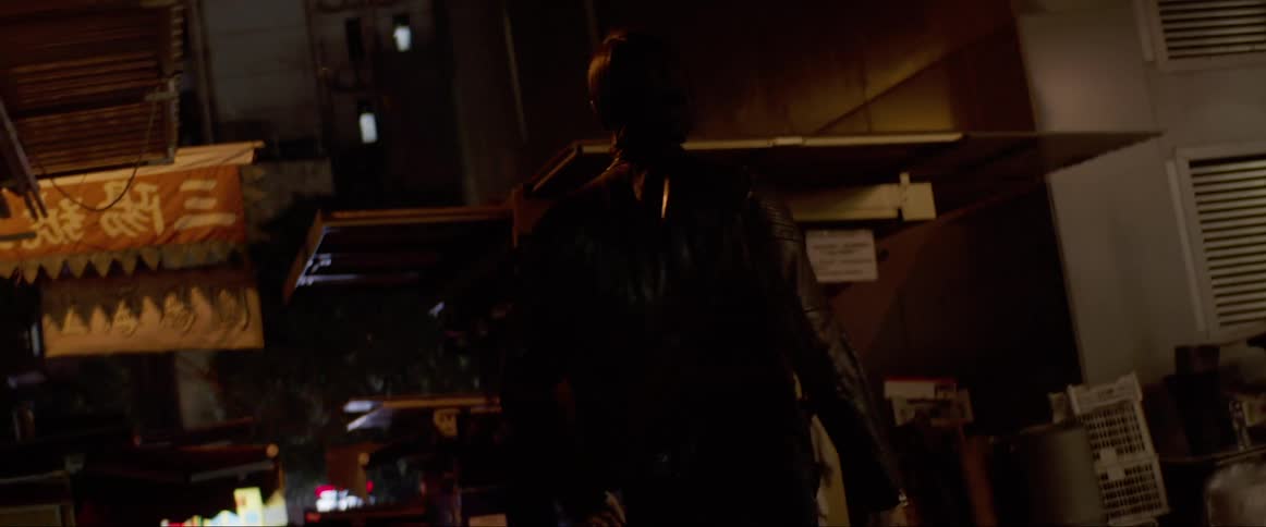 Man looks around in the street at night