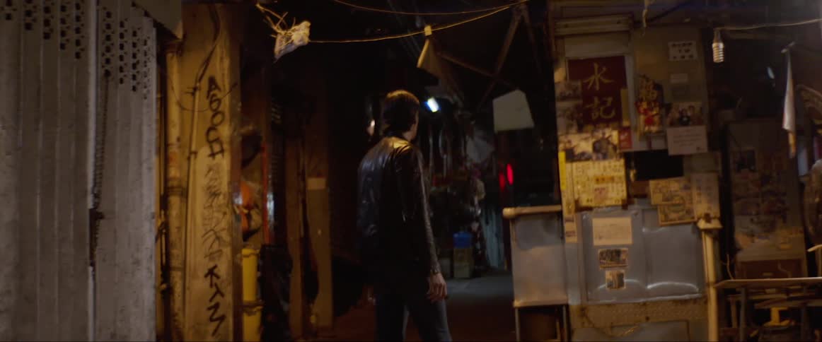 Man turns around in the alley at night
