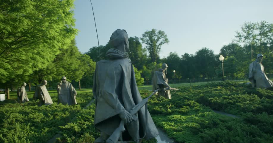 Statues of american soldiers stand in a memorial park