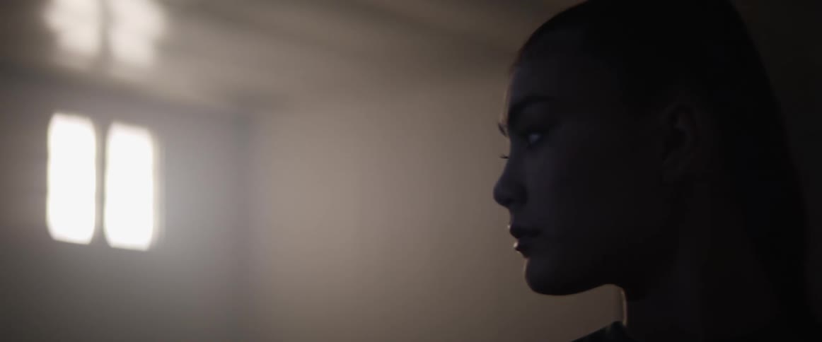 Asian woman looks down in the room