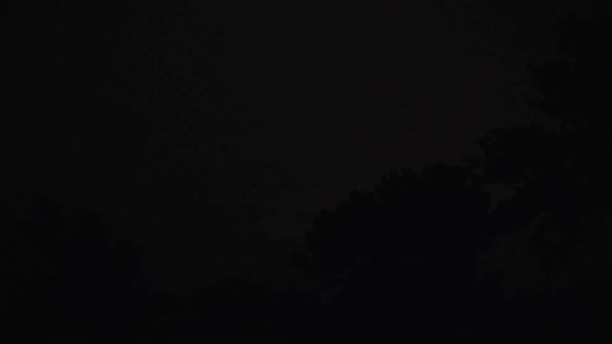Lightning arcs across the sky during a storm at night
