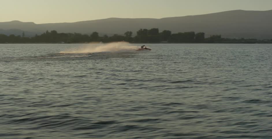 A person rides a jet ski in the water