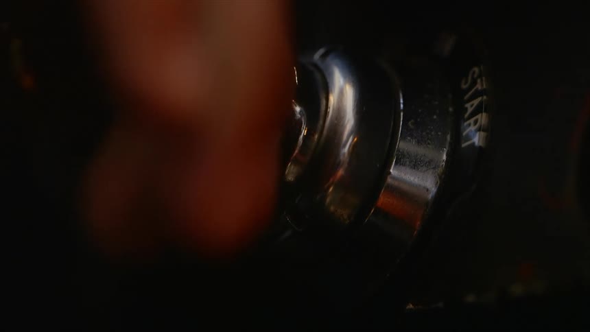 A man puts a key in an ignition