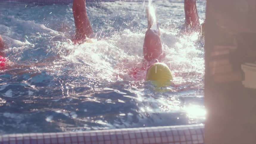 White women swim in a pool in sync