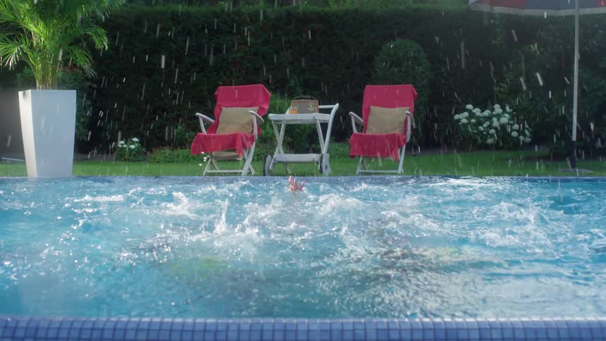 Five women sync their swimming in an outdoor pool