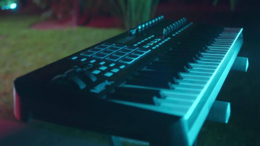A keyboard on a stand sits inside a home