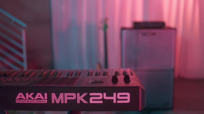 A mixing console guitar and amp sit in a studio