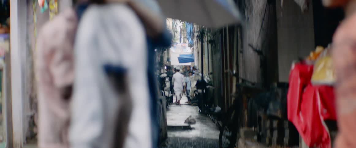 People walk in the narrow street
