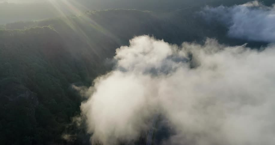 Aerial view of clouds over hills