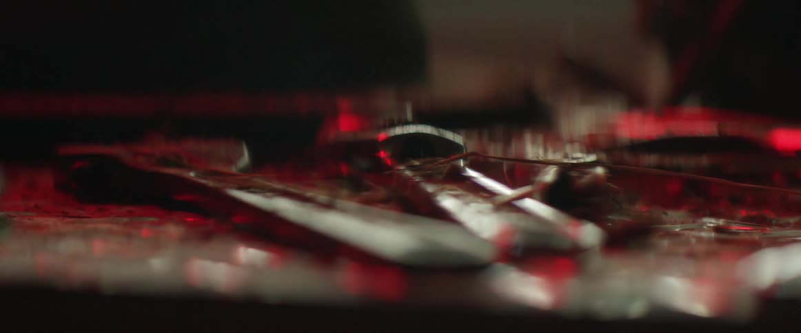Close up of some tools on a bench in a dark area
