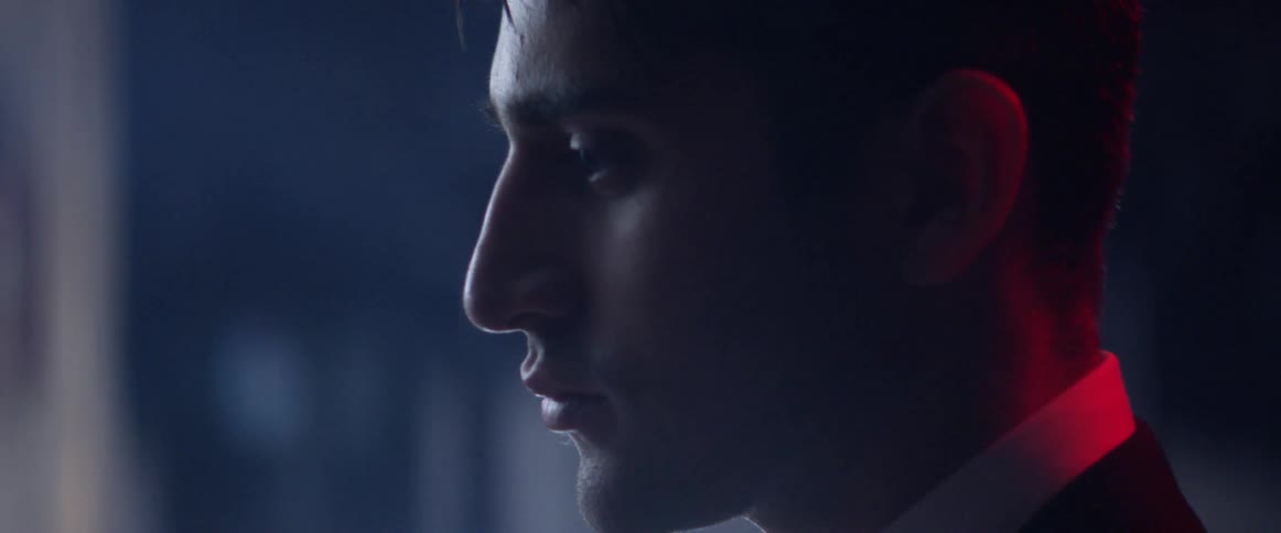 Profile view of a man gazing at something in front of him