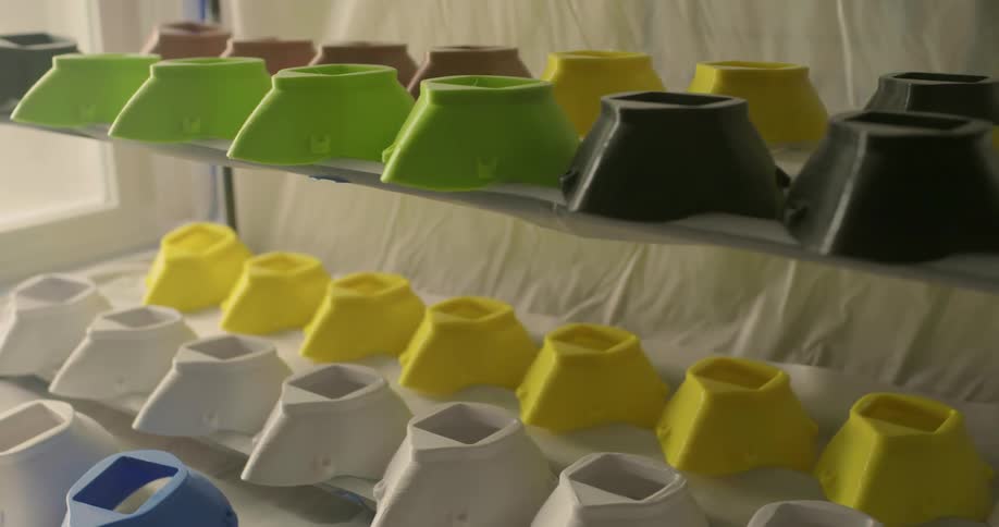 Colorful plastic containers in a shelf