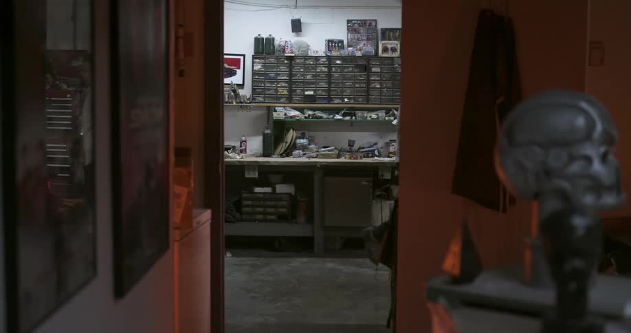 A man grabs an item from the shelf and walks away
