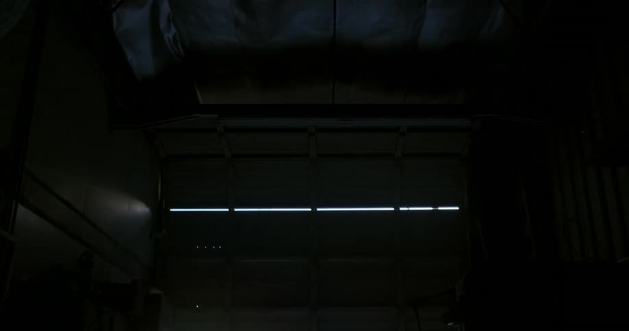 The garage door slowly moves