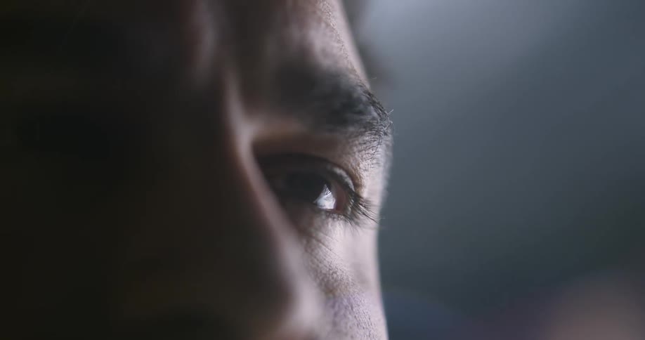 A closeup of a mans face is displayed