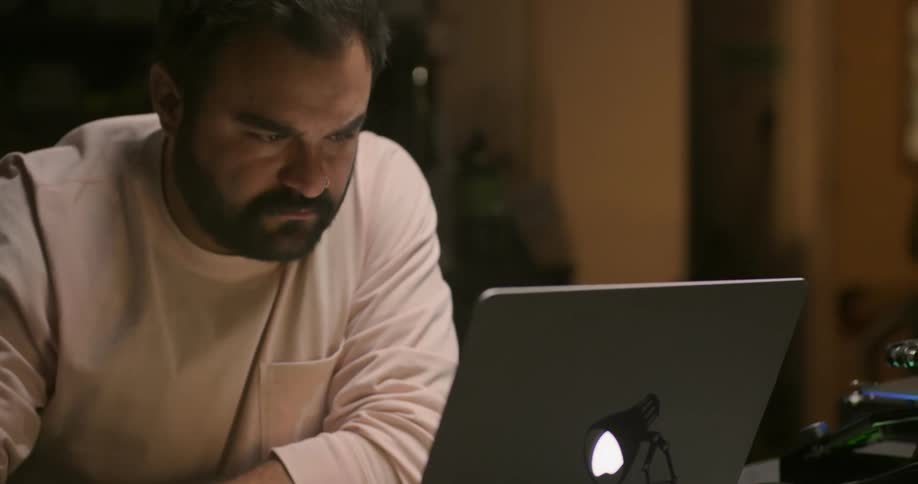 A man works on his laptop