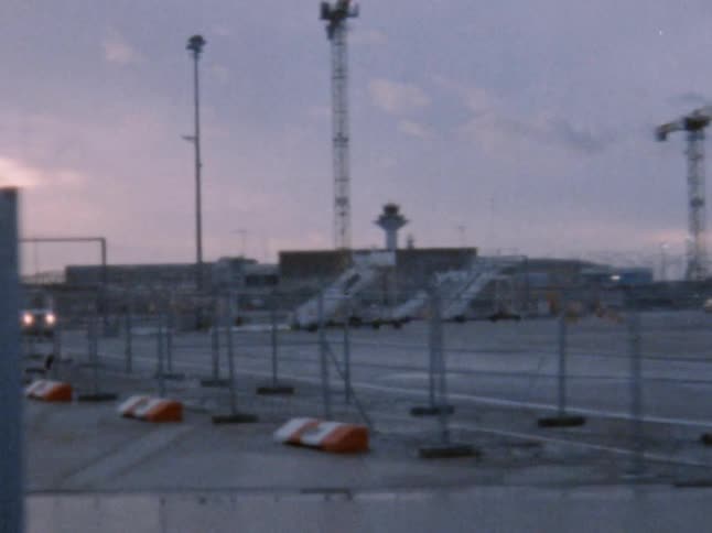 A car drives through an area of an airport