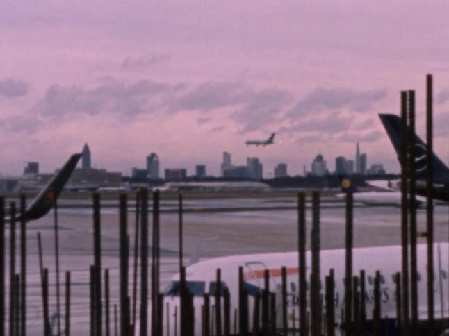 A passenger jet airliner comes in for a landing at an airport