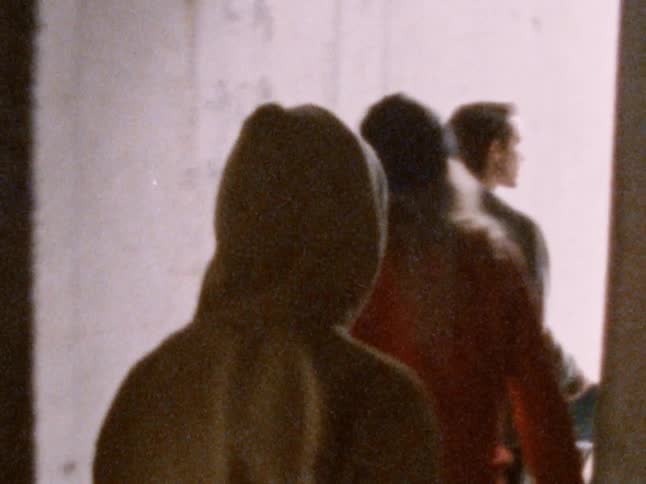 Group of friends walk out of a building exit