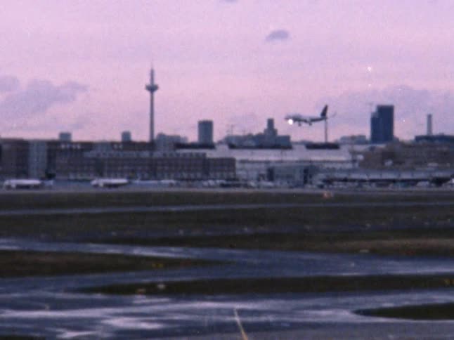 A large passenger plane comes in for a landing at an airport